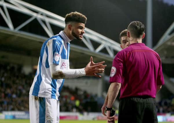 Huddersfield Town's Elias Kachunga appeals to the assistant referee after Newcastle United score their second goal.