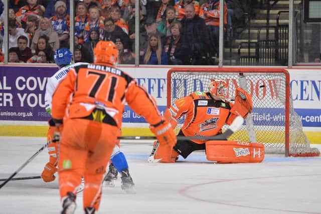 DOUBE TROUBLE: Coventry's Brett Robinson (No 23) fires past Ervins Mustukovs to put the visitors 2-0 ahead at Sheffield Arena. Picture: Dean Woolley.