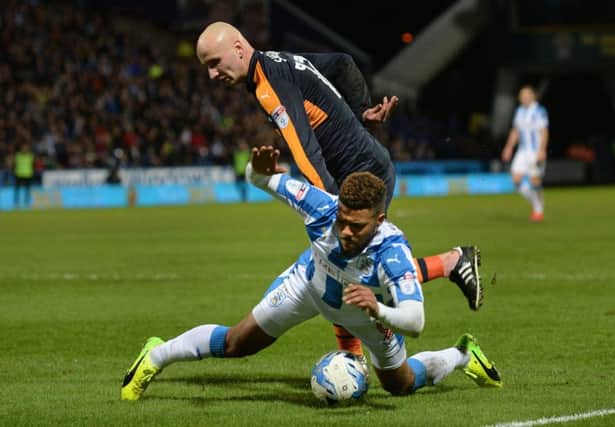 Elias Kachunga is taken down in the box by Jonjo Shelvey for Town's penalty scored by Aaron Mooy.
  Picture: Bruce Rollinson