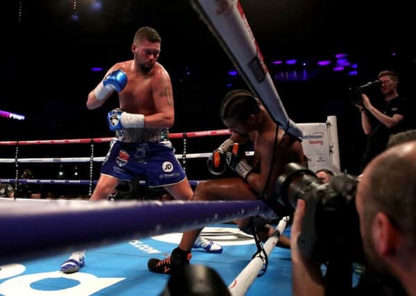 Knockout: Underdog Tony Bellew ends his grudge match with David Haye by knocking him through the ropes in the 11th round. (Picture: Nick Potts/PA Wire)