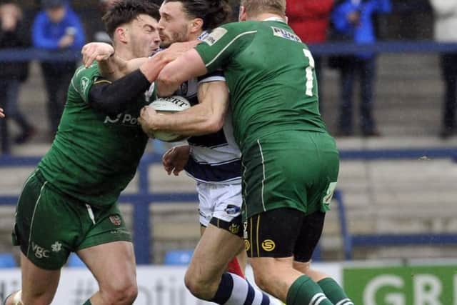 High impact: Tom Arscott, centre, one of the Yorkshire Carnegie players guilty of errors in the first half, is schackled by two London Irish players. (Picture: Steve Riding)