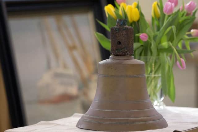 A ships bell, recovered from the Herald of Free Enterprise, stands on a table next to flowers during a remembrance service for victims of the disaster at the Saint Donaas Church in Zeebrugge, Belgium on Sunday, March 5, 2017. On March 6, 2017, thirty years will have passed since the ferry Herald of Free Enterprise capsized with the loss of 193 lives shortly after setting out to Dover from the Belgian port of Zeebrugge. The bell was recovered from the ship during the salvage operation and will be presented to the town of Dover. (AP Photo/Virginia Mayo)