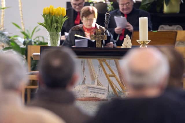 People attend a service of remembrance for the the victims of the Herald of Free Enterprise at the Saint Donaas Church in Zeebrugge, Belgium on Sunday, March 5, 2017. On March 6, 2017, thirty years will have passed since the ferry Herald of Free Enterprise capsized with the loss of 193 lives shortly after setting out to Dover from the Belgian port of Zeebrugge. (AP Photo/Virginia Mayo)