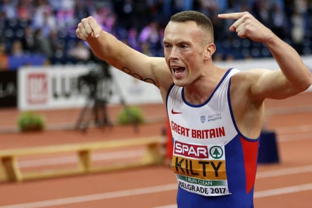 Britain's Richard Kilty celebrates winning the men's 60-meter final . (AP Photo/Marko Drobnjakovic)