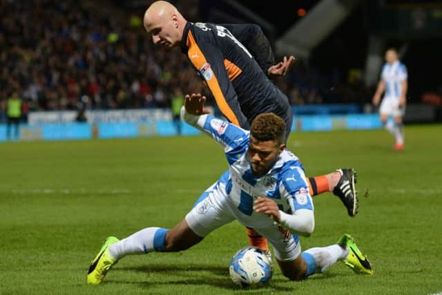 Elias Kachunga is taken down in the box by Jonjo Shelvey in the incident that led to Town's penalty converted by Aaron Mooy.
 (Picture: Bruce Rollinson)