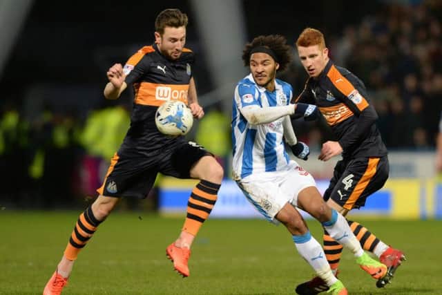 No way through for Isaiah Brown past Paul Dummett and Jack Colbeck as Huddersfield Town were beaten by Newcastle United. (Picture: Bruce Rollinson)