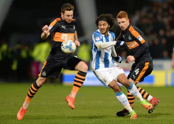 No way through for Isaiah Brown past Paul Dummett and Jack Colbeck as Huddersfield Town were beaten by Newcastle United. (Picture: Bruce Rollinson)