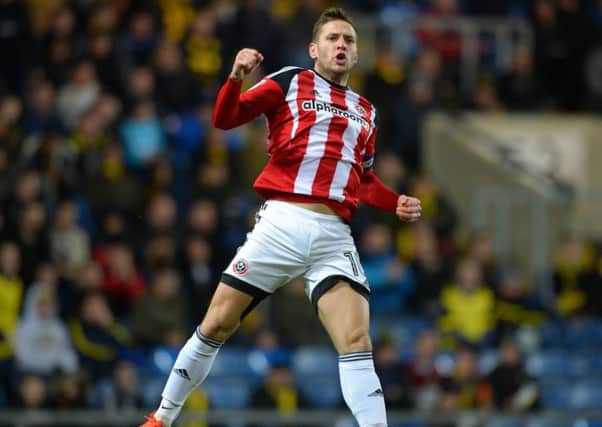 Billy Sharp celebrates scoring the equalising goal against Oxford.(Picture: Robin Parker/Sportimage)