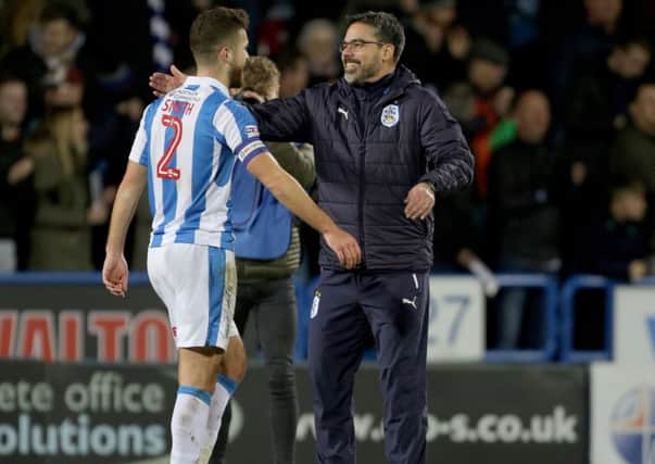 Huddersfield Town manager David Wagner with match winner Huddersfield Town's Tommy Smith