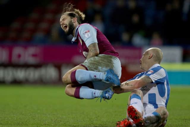 Huddersfield Town's Aaron Mooy fouls Aston Villa's Henri Lansbury (Picture: Richard Sellers/PA Wire)
