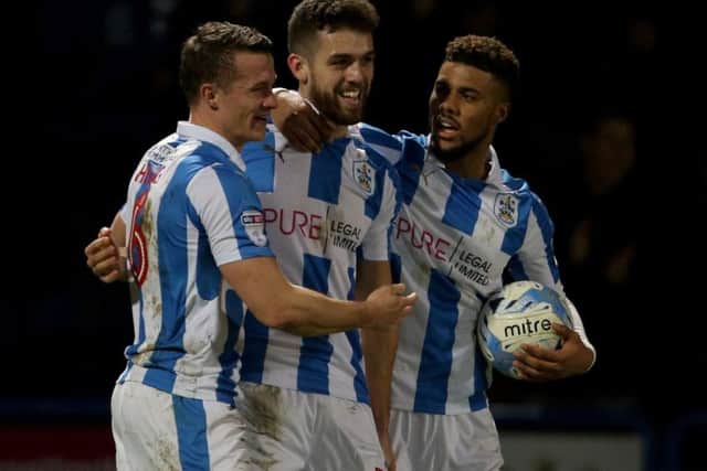 Huddersfield Town's Tommy Smith (centre) is congratulated by team-mates after his winning goal against Villa. (Picture: Richard Sellers/PA Wire)