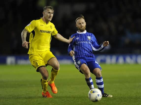 ON THE BALL: Sheffield Wednesdays Barry Bannan challenging Burton Albions Kyle McFadzean at Hillsborough. Picture: Steve Ellis