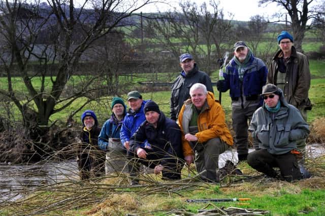 Some of the  volunteers from the Bradford City Anglers Association working on the river banks alongside the River Aire near to Skipton.