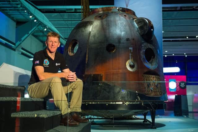 British astronaut Tim Peake with the Russian Soyuz capsule which carried him and his crew to and from the International Space Station. Dominic Lipinski/PA Wire