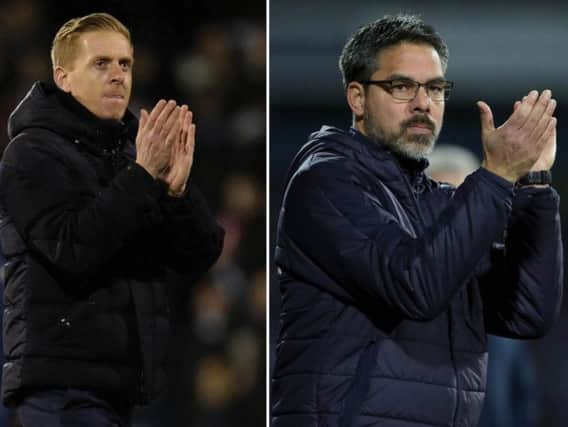 David Wagner, right, oversaw a crucial win for Huddersfield Town, with Garry Monk, left, deflated by a late Fulham goal against Leeds