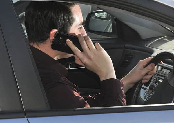 Drivers using their mobile phone behind the wheel should face more draconian punishments, says Paul Emsley.