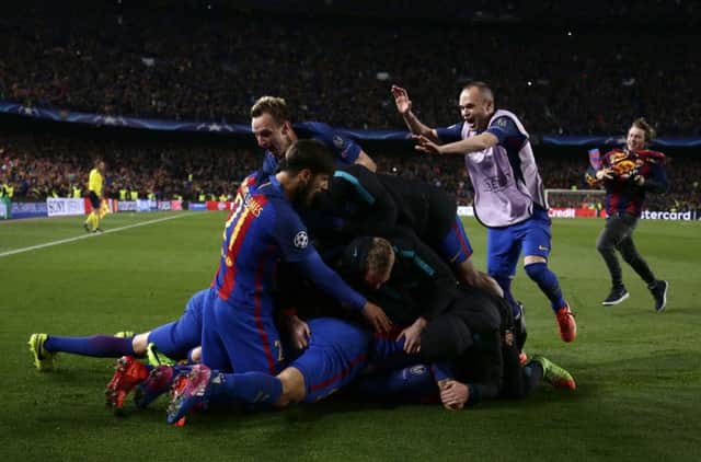 STUNNING: Barcelona players celebrate their victory at the end of the Champion League round of 16, second leg soccer match against Paris Saint Germain at the Camp Nou. Picture: AP/Emilio Morenatti