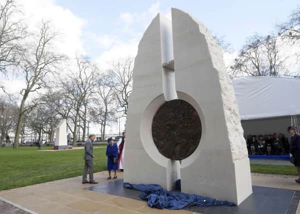Queen Elizabeth II unveils a new Iraq and Afghanistan memorial by Paul Day at Victoria Embankment Gardens in London, honouring the Armed Forces and civilians who served their country during the Gulf War and conflicts in Iraq and Afghanistan.