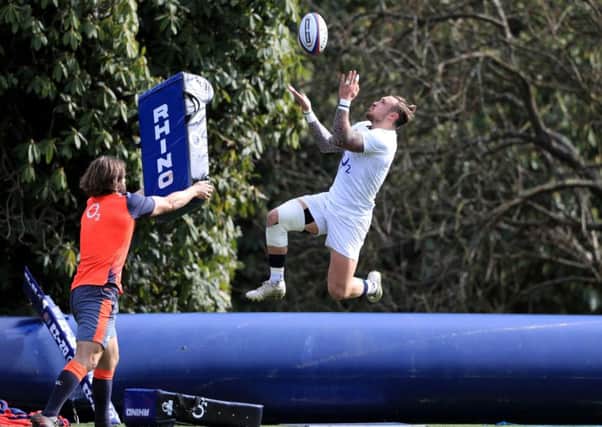 High ball: Jack Nowell, right, soars high to claim a kick during training at Englands Pennyhill Park base. (Picture: Adam Davy/PA)
