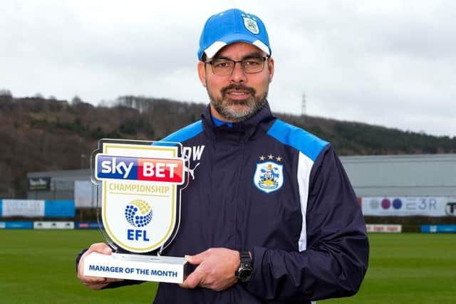 TOP MAN: Town head coach David Wagner with his Championship manager of the month award for February. Picture: Robbie Stephenson