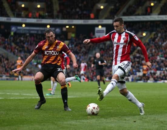 Bradford City's Rory McArdle battles with Sheffield United's Daniel Lafferty earlier this season. Picture: Simon Bellis/Sportimage