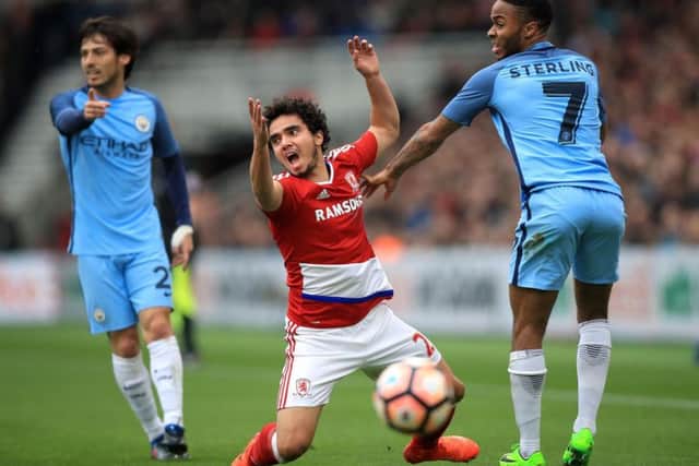 Middlesbrough's Fabio falls over a Raheem Sterling challenge (photo: PA)