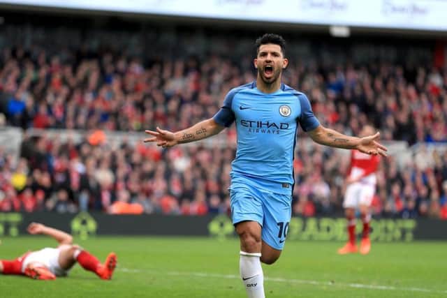 Sergio Aguero celebrates doubling the lead for the visitors (Photo: PA)