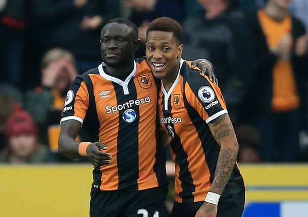 Hull City's Oumar Niasse (left) celebrates scoring his side's first goal of the game during the Premier League match at the KCOM Stadium, Hull. PRESS ASSOCIATION Photo. Picture date: Saturday March 11, 2017. See PA story SOCCER Hull. Photo credit should read: Nigel French/PA Wire. RESTRICTIONS: EDITORIAL USE ONLY No use with unauthorised audio, video, data, fixture lists, club/league logos or "live" services. Online in-match use limited to 75 images, no video emulation. No use in betting, games or single club/league/player publications.