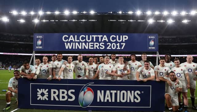 CHAMPIONS: England players celebrate winning both the Calcutta Cup and the Six Nations title following victory over Scotland at Twickenham. Picture: David Davies/PA