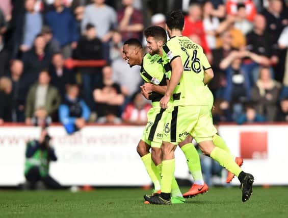 Huddersfield Town's Rajiv van La Parra (left) celebrates scoring what proved to be the winning goal at Brentford. Picture: Daniel Hambury/PA