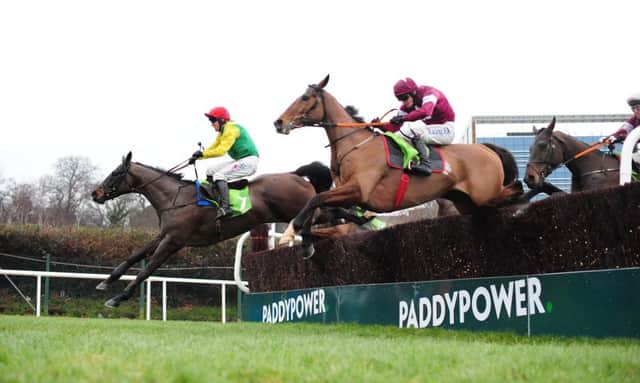Sizing John ridden by Robbie Power leads Don Poli (near) over the last before winning the Stan James Irish Gold Cup during the Stan James Irish Gold Cup Day at Leopardstown last month. Picture: PA.