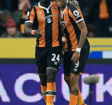 Hull City's Oumar Niasse (left) celebrates scoring his first goal against Swansea. Picture: Nigel French/PA