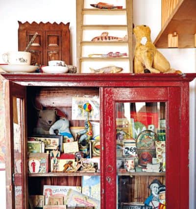 This treasured red cabinet is full of Emily's finds and curios.