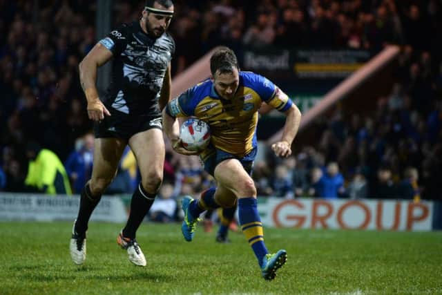 Danny McGuire crosses the line for his try against Catalans Dragons. (Picture: Bruce Rollinson)
