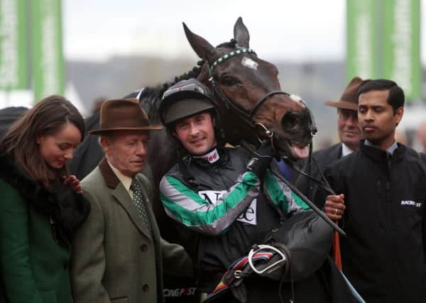 Jockey Nico De Boinville and Altior celebrate winning the  Racing Post Arkle Challenge Trophy Novices' Chase.