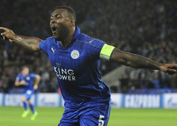 Leicester's Wes Morgan celebrates after he scores a goal during the Champions League round of 16 second leg against Sevilla at the King Power Stadium. (AP Photo/Rui Vieira)