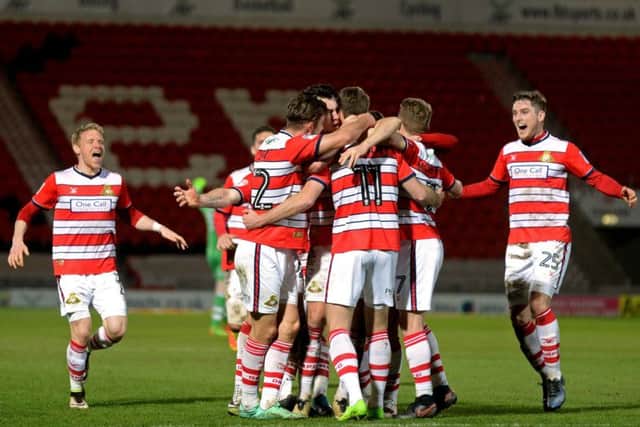 Rovers celebrate Andy Williams scoring Doncaster's third goal against Notts County. (Picture: Bruce Rollinson)
