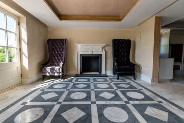 The property has decorative marble floors throughout