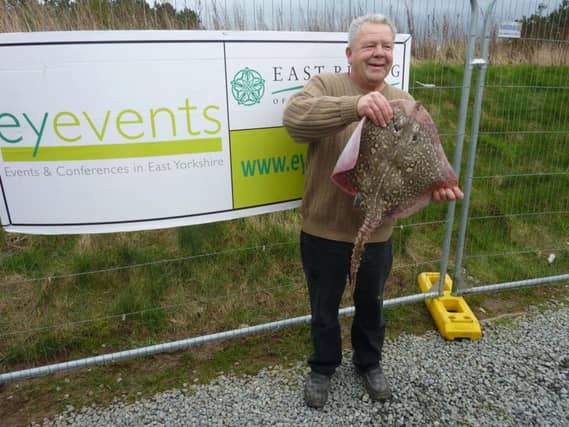 Graham Elliott of Hull, champion of the 2017 Paul Roggeman European Open Beach Championship, holding aloft his winning catch of a thorny backed ray
