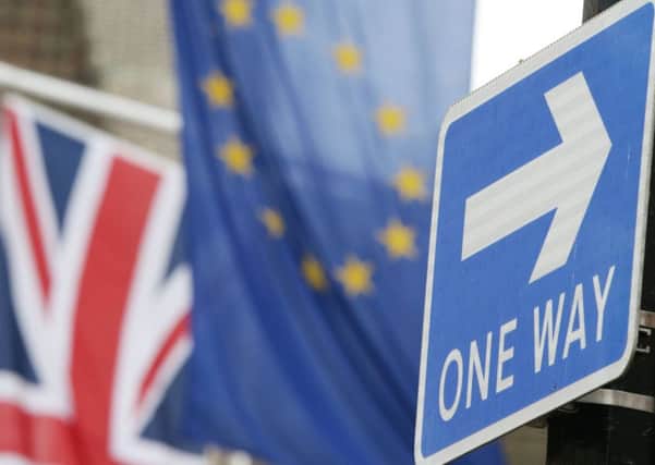 A road traffic sign is in front of the Union Jack and the European Union flag hanging outside Europe House in Smith Square, London. British citizens should be able to choose to keep various benefits of EU membership including the freedom of movement after Brexit, the European Parliament's chief negotiator has said. PRESS ASSOCIATION Photo. Picture date: Friday March 10, 2017. Guy Verhofstadt said he hoped to convince European leaders to allow Britons to keep certain rights if they apply for them on an individual basis. See PA story POLITICS Brexit. Photo credit should read: Yui Mok/PA Wire