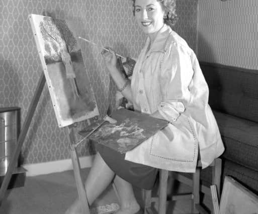 Vera Lynn painting at her home in Finchley, London, in 1956