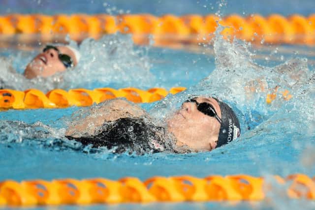 England's Lizzie Simmonds (right) in heat 1 of the Women's 200m Backstroke at Tollcross Swimming Centre, during the 2014 Commonwealth Games in Glasgow. (Picture: Joe Giddens/PA Wire)
