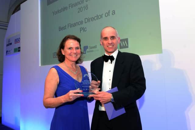 The 2016 Yorkshire Finance Director Awards at The Queens Hotel, Leeds. Richard Naish of Walker Morris presents The Best Finance Director of a PLC award to Allison Bainbridge of VP Group. 20th October 2016. Picture : Jonathan Gawthorpe