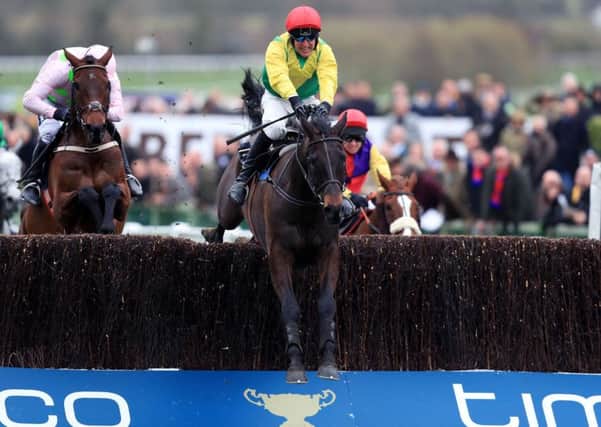 Sizing John ridden by Robbie Power on their way to victory in the Timico Cheltenham Gold Cup . Picture: Mike Egerton/PA