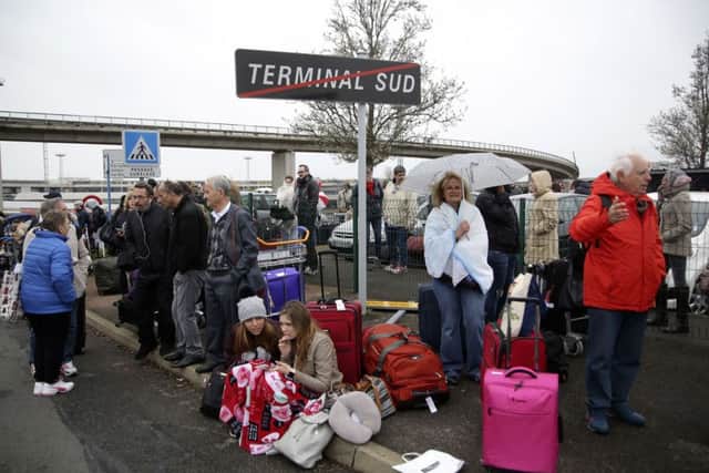 French police say a man was shot to death after trying to seize the weapon of a soldier guarding Paris' Orly Airport.