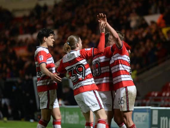 Doncaster Rovers remain six points clear at the top of League Two