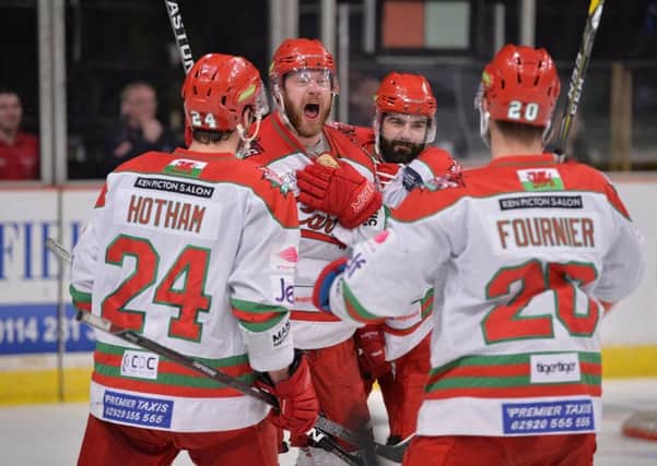 Cardiff Devils' player-coach Andrew Lord, second left, celebrates with his team after going 5-2 up against Sheffield Steelers on Saturday night. Picture: Dean Woolley.