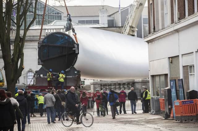 Art work Blade, a 250ft-long (75m) wind turbine, which is now returning to the city's Alexandra Dock