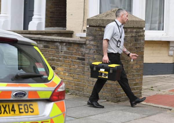 Police officers enter the scene in Wilberforce Road, near Finsbury Park, in north London. Picture: Victoria Jones/PA Wire