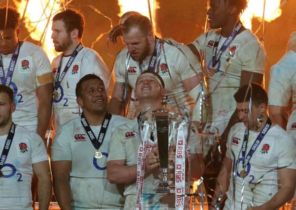 England captain Dylan Hartley holds the Six Nations trophy, which they were assured of ahead of their loss to Ireland (Picture: PA).